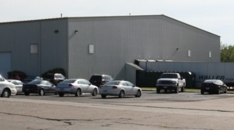 A long shot of the trucks and cars parked at the Industrial